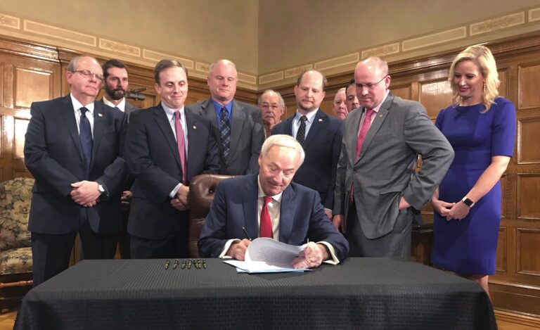 Arkansas governor signs $95M highway funding bill into law