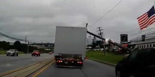 Oversized load takes out power poles