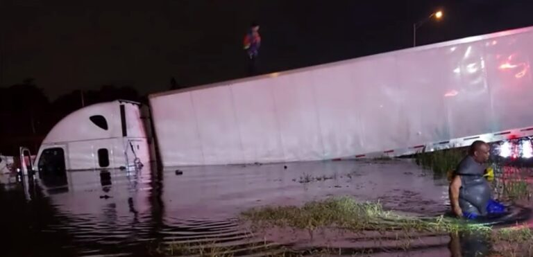Driver OK after semi-truck crashes into retention pond