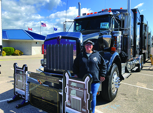 Su Schmerheim combines love for animals, trucking as professional horse hauler