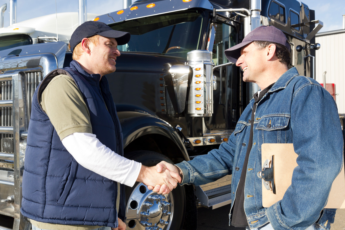 Truckers shaking hands