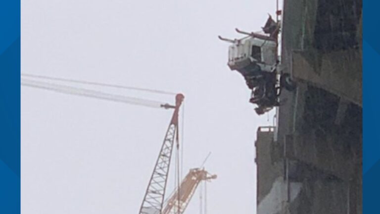 Trucker rescued as semi hangs from bridge over Elizabeth River