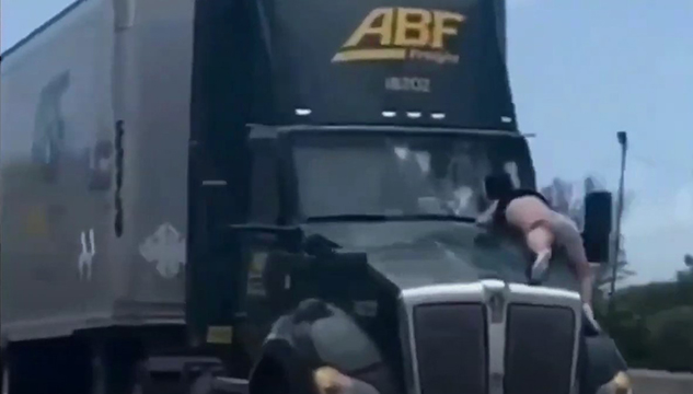 Florida man clings to hood of semi-truck for 9-mile ride