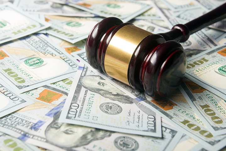 Former trucking company employee ordered to pay back nearly $600,000 in wire fraud case