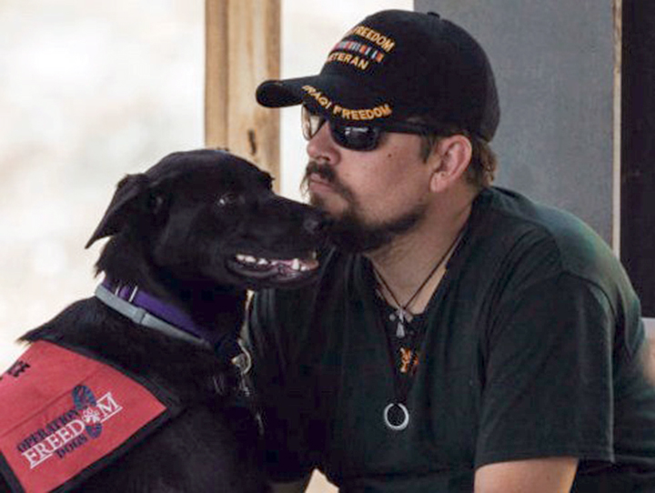 U.S. Xpress partners with program matching service dogs with vets suffering from PTSD