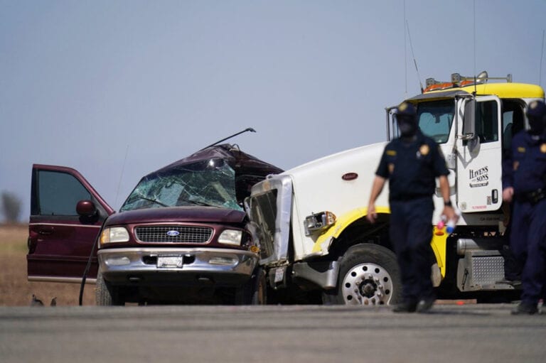 SUV came through hole in border fence before crash with semi, 13 dead