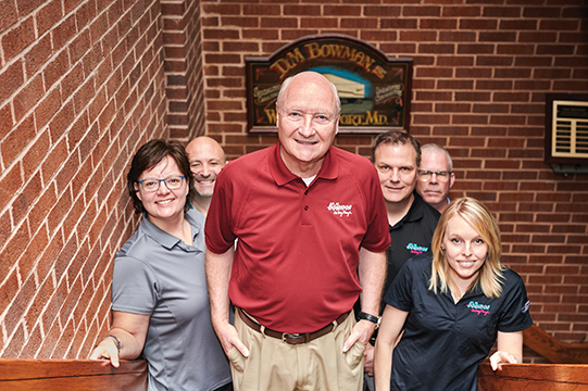Jim Ward with employees