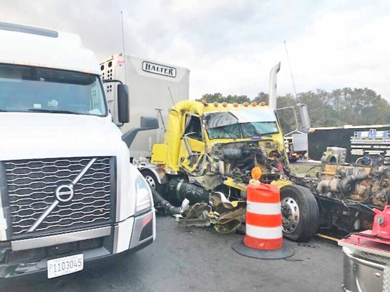 Crash south of Garrett leaves truck on top of car, sends 2 to hospital