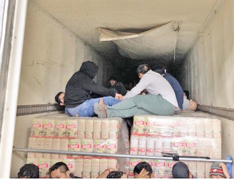 Dozens of migrants found locked in refrigerated trailer