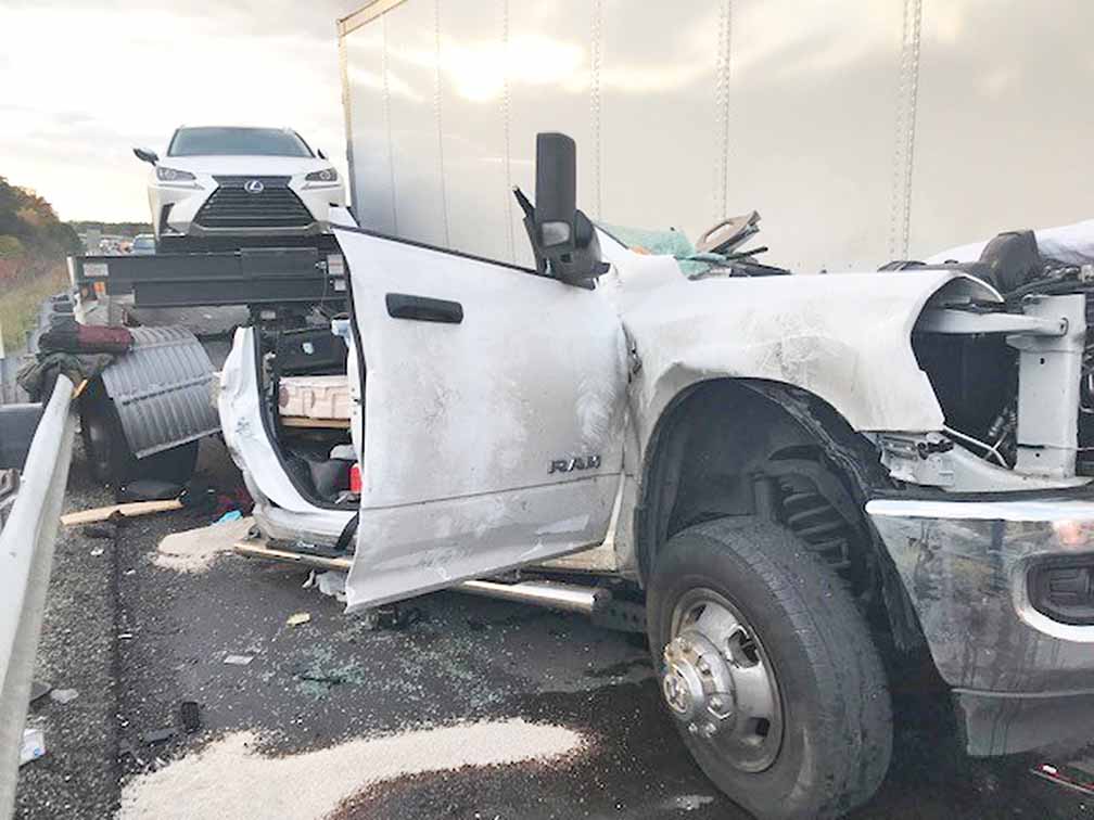 Crash south of Garrett leaves truck on top of car, sends 2 to hospital