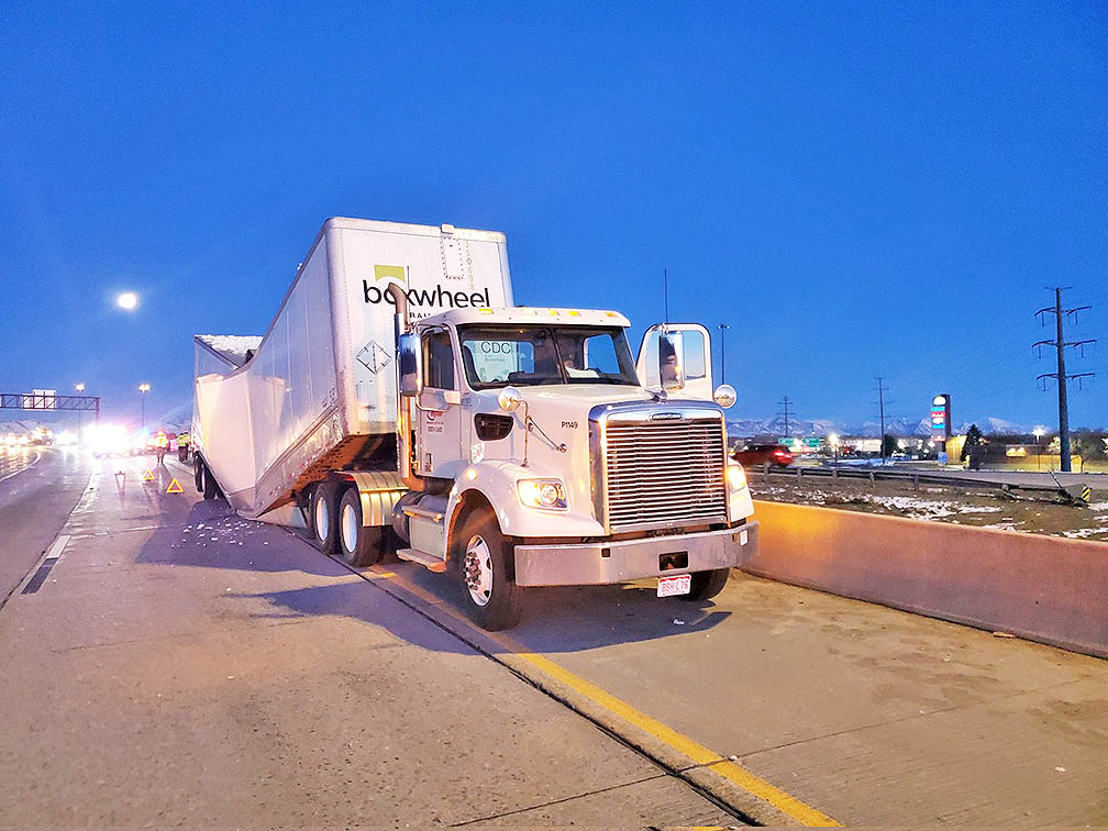 Trailer overloaded with beer snaps in half on Colorado interstate