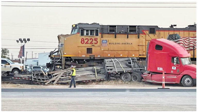 Truck driver uninjured after train smashes into rig