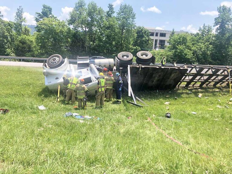 Chicken truck flips on I-24, trapping driver