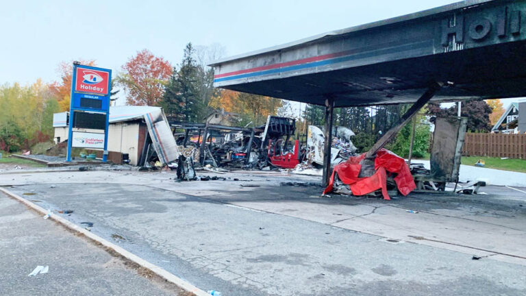 Man killed while pumping gas after big rig slams into station; driver arrested for intoxication, causing death