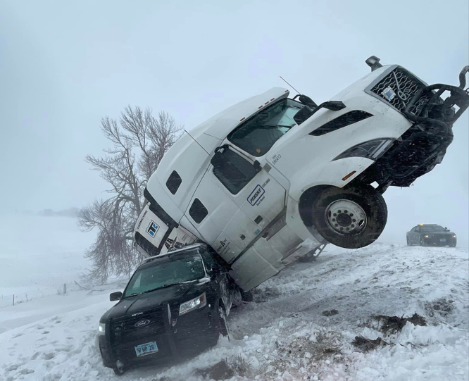 Wild wreck leaves big rig askew on top of South Dakota trooper’s unit