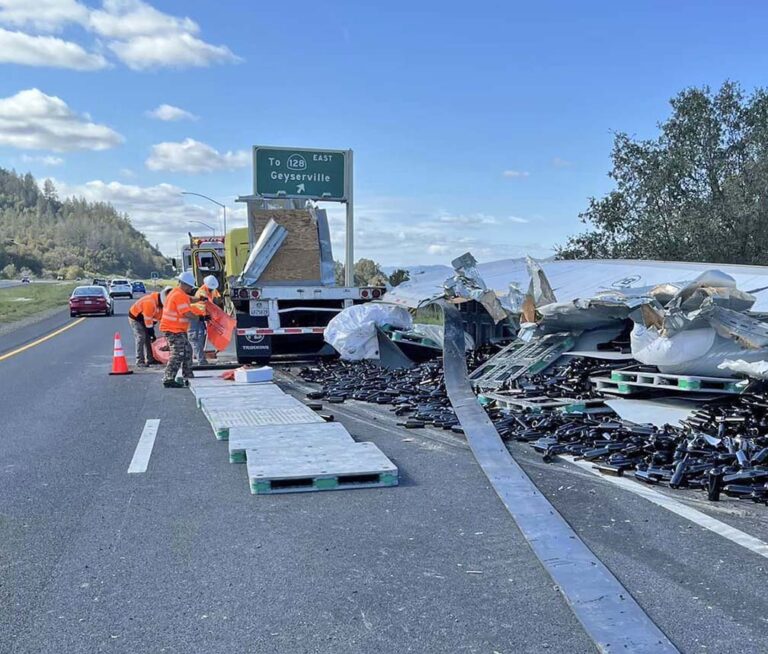 Truck spills load of 10K empty wine bottles on California highway