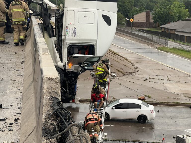 Oklahoma City firefighters rescue truck driver whose rig ran off I-44 bridge