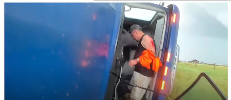 Video shows storm chaser helping trucker after tornado overturns rig in Hawk Springs, Wyoming