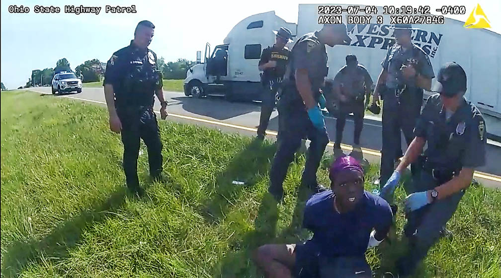 Ohio cops release attack dog on trucker after he surrenders following