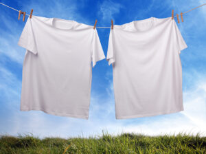 Blank white t shirt hanging on clothesline
