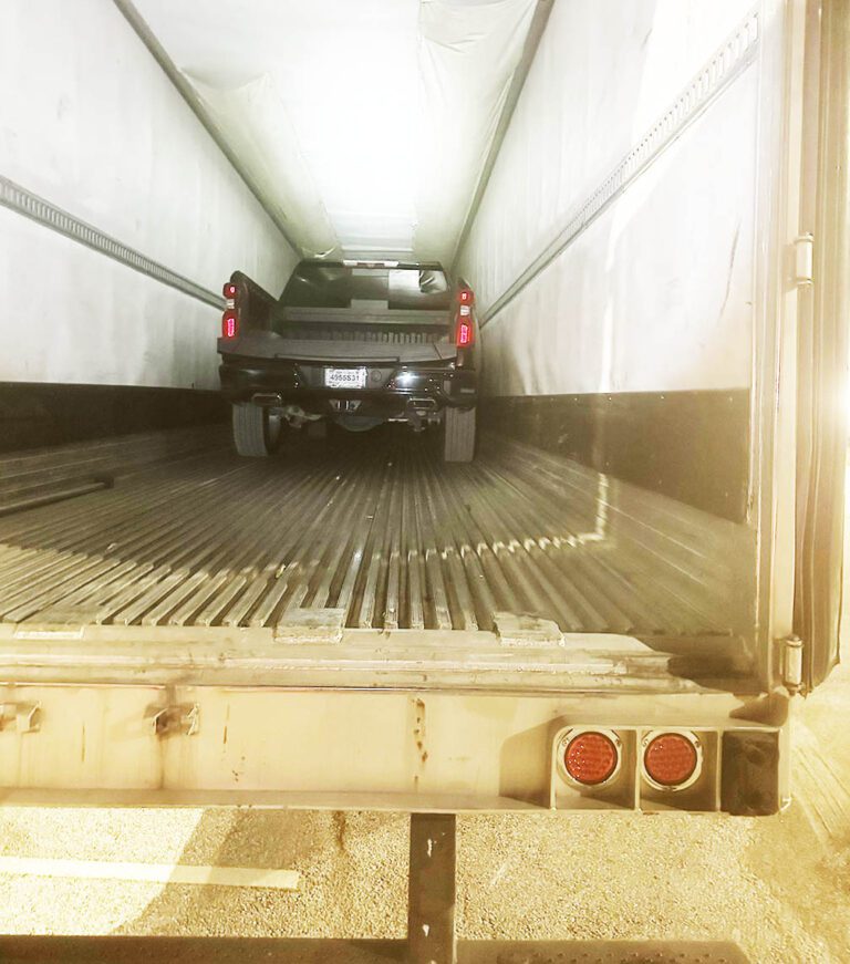 Trucker arrested in Texas after 2 stolen pickups found inside trailer