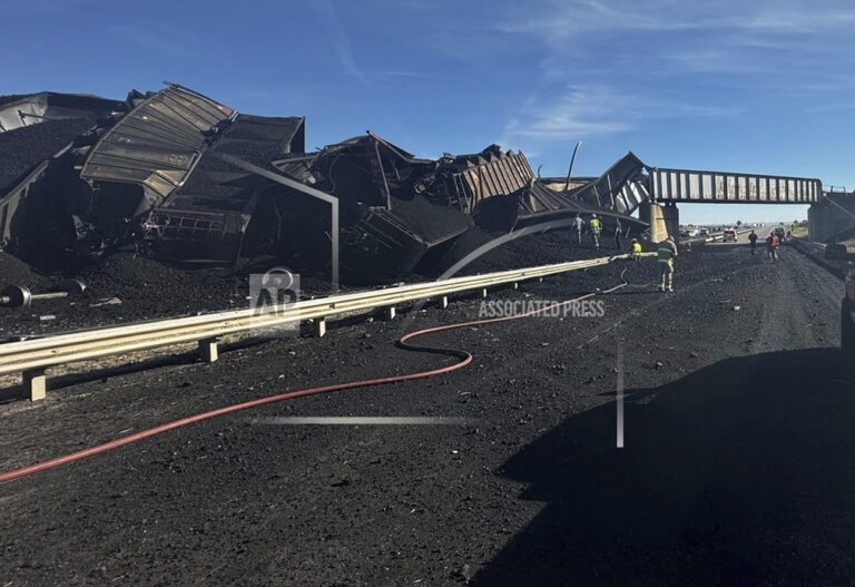 Semi-truck driver killed, train derails, spilling train cars and coal onto a highway in Colorado