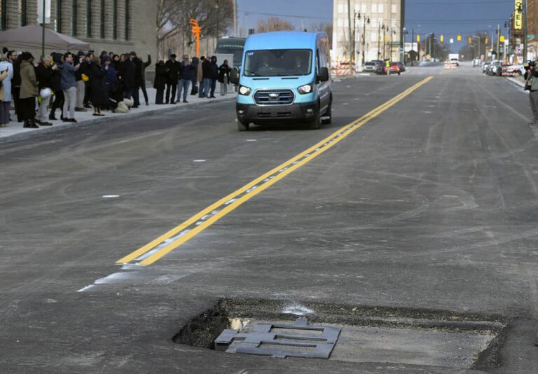 New tech installed beneath Detroit street charges electric vehicles as they drive