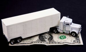 Semi Truck on Dollar iStock 1929638696