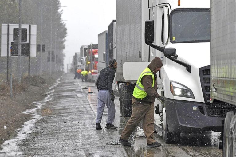 Drone video shows miles of stalled big rigs as massive snowstorm closes parts of I-80