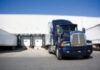 Blue Tranport Truck Docking in warehouse