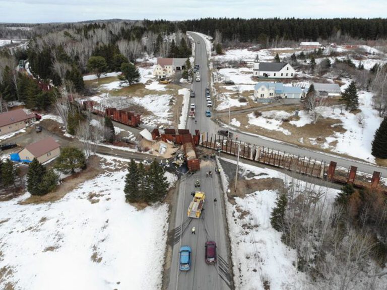 Big rig hits, derails Maine freight train