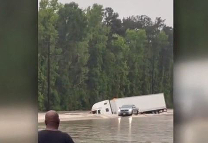 Video shows big rig, driver being swept away by Texas floodwaters