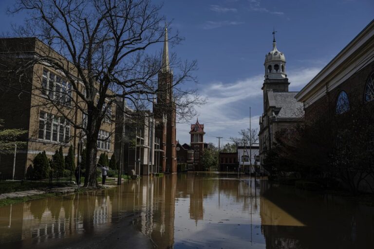 Kentucky watches for surging rivers to recede so widespread cleanup can begin