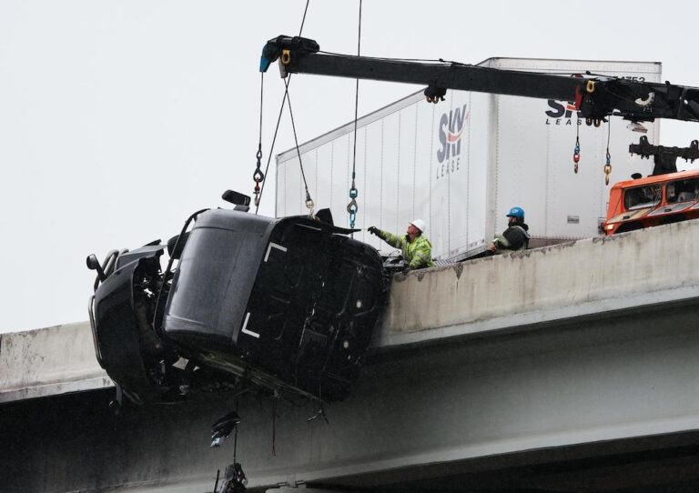 Rescuers get to driver hanging from Louisville bridge on I-65