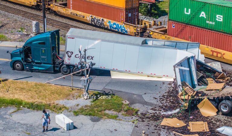 Train collision with big rig shuts down roadway for several hours