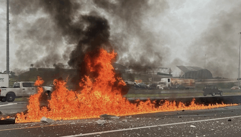 Big rig bursts into flames after hitting median in Tampa