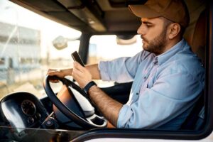 Trucker with cellphone iStock 1396633198 web