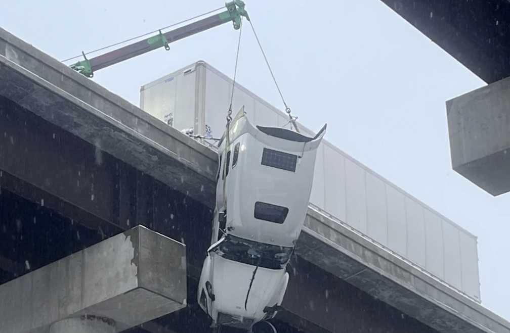Trucker rescued after dangling off West Virginia bridge for more than 5 hours
