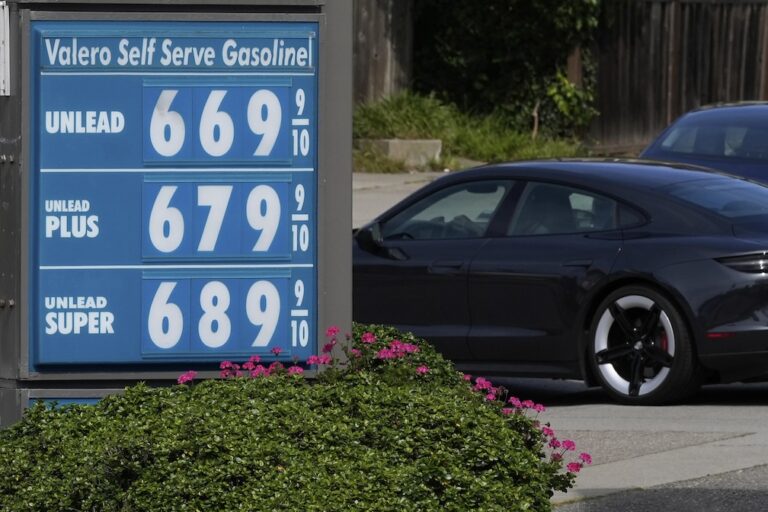 Wall Street slides, oil prices again over $100 a barrel as US and Iran trade threats over ports