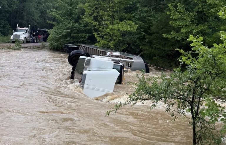 Driver uninjured after truck flips in flood waters in Oklahoma
