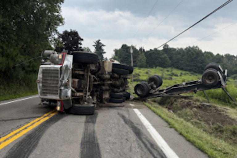New York police investigating crash involving log truck and tanker