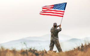 Soldier with Flag iStock 1404226519 T