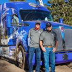 Theron Schmalzried, left, and William “Butch” Hanna, right, drivers with Colorado-based Apex Transportation, were tapped to drive this year’s U.S. Capitol Christmas Tree to Washington, D.C. (Courtesy: James Edward Mills)