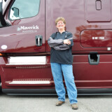 Liz Imel has driven for Maverick Transportation since 2012. She started out hauling refrigerated trailers; but when the company sold its refrigerated division, she moved over to hauling boats on flatbed trailers. (Hannah Butler/The Trucker)