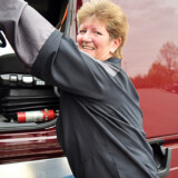 Liz Imel has driven for Maverick Transportation since 2012. She started out hauling refrigerated trailers; but when the company sold its refrigerated division, she moved over to hauling boats on flatbed trailers. (Hannah Butler/The Trucker)