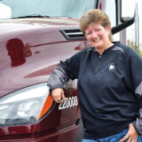 Liz Imel has driven for Maverick Transportation since 2012. She started out hauling refrigerated trailers; but when the company sold its refrigerated division, she moved over to hauling boats on flatbed trailers. (Hannah Butler/The Trucker)