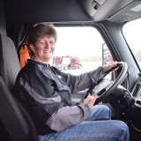Liz Imel has driven for Maverick Transportation since 2012. She started out hauling refrigerated trailers; but when the company sold its refrigerated division, she moved over to hauling boats on flatbed trailers. (Hannah Butler/The Trucker)