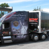 Garner Trucking’s military-themed tractors are used to deliver donated wreaths for the annual Wreaths Across America Event. (Courtesy: Garner Trucking)