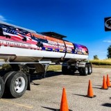 Trout Trucking Company Inc. features military-wrapped trucks and tanks. Every Veterans Day, the company hosts a dinner and tank signing. (Courtesy: Trout Trucking)