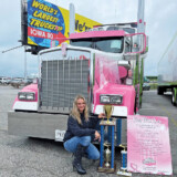 Knelsen poses with the trophy for winning first place in the company work truck combination category in the 2021 Walcott Truckers Jamboree Super Truck Beauty Contest. (Courtesy: Eva Knelsen)